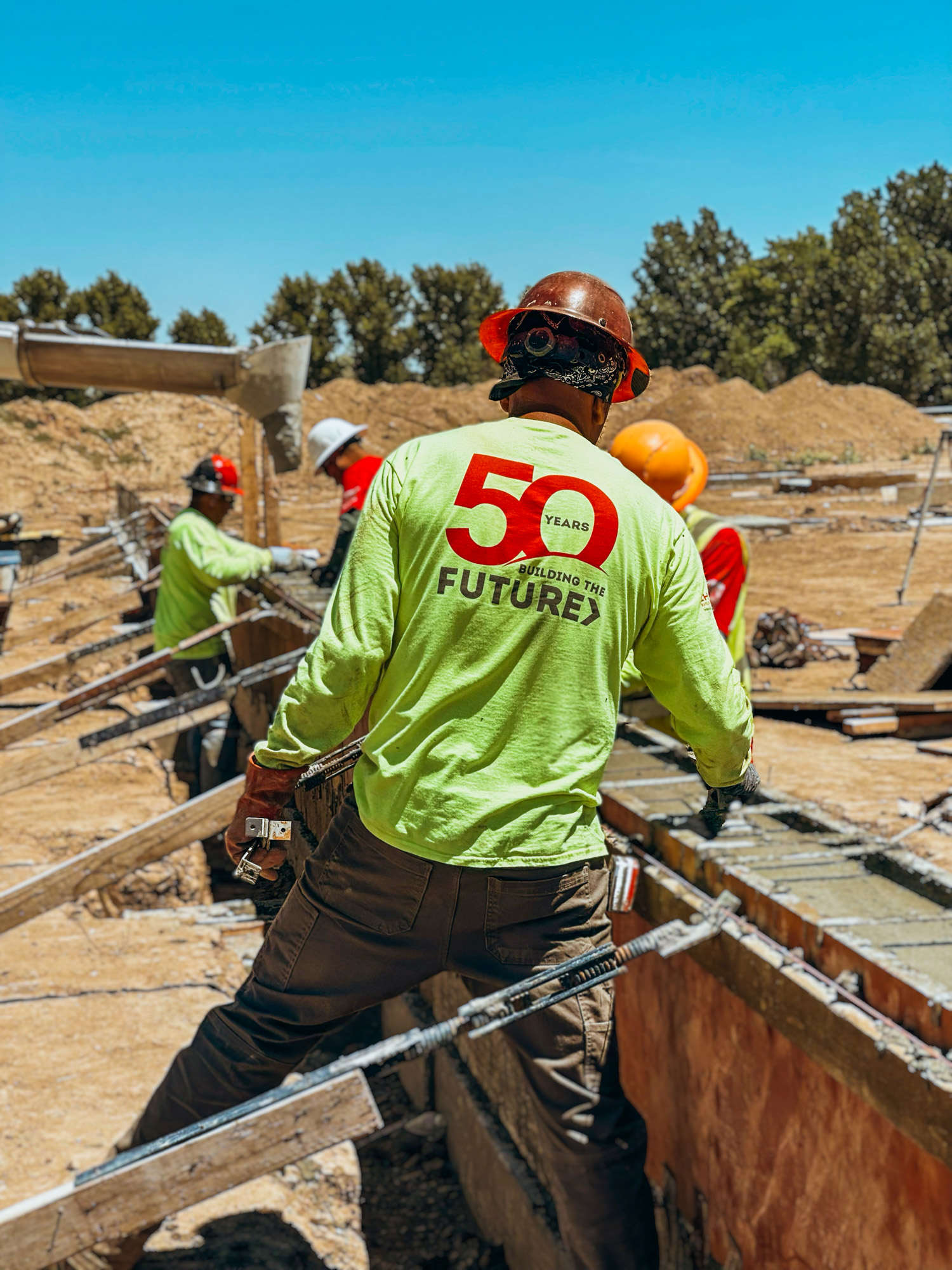 PBC 50 years strong shirt as the employees work on site